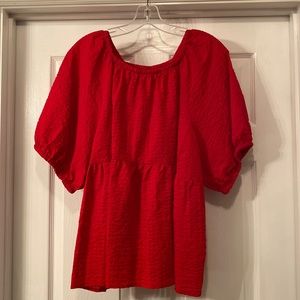 NWT Women’s red seer sucker blouse. Pouf sleeve, scoop neck. Flared bottom.